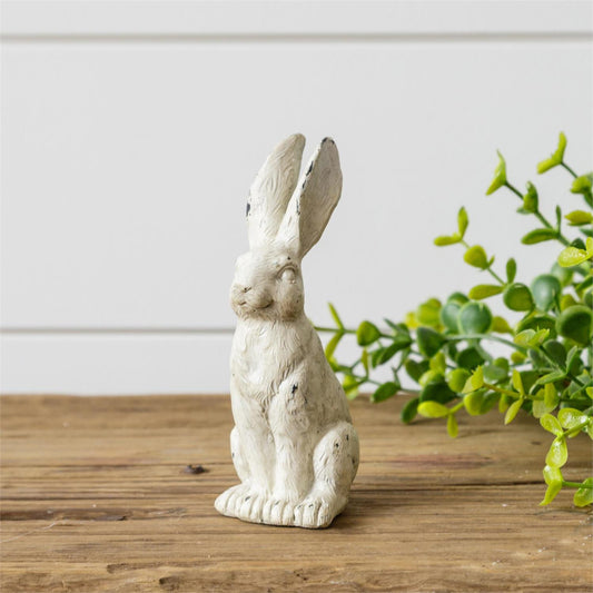 This small distressed white bunny measures only 5 inches tall by 1.75 inches wide and 2.25 inch.  He is made of stone powder and resin.  