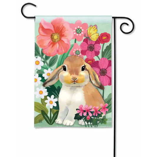 Big beautiful colorful flowers surround an adorable bright eyed brown and white bunny!  