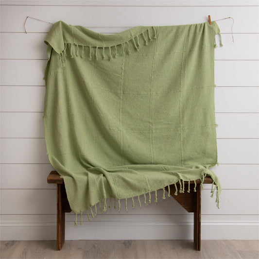 Celery green throw with tassels.  Material is a cotton polyester blend and measures 59 inches by 67 inches.