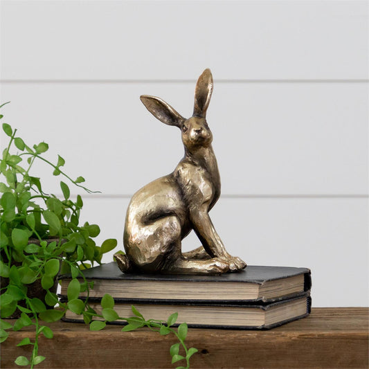 Sitting rabbit in brass tone.  Measures 8.5 inches high by 4.5 inches wide by 6 inches deep.  Looks great and sure to draw attention sitting on a shelf, mantle or table.