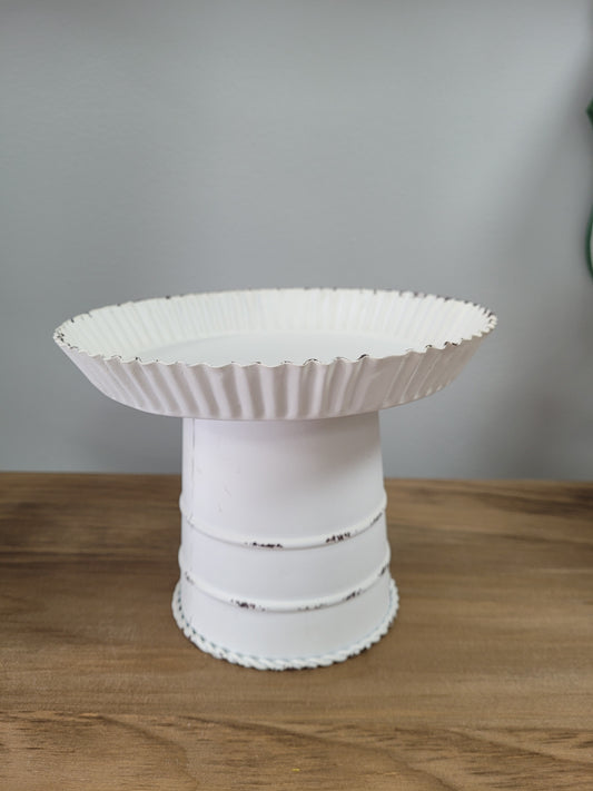 Fluted Pie Pan Design Candle Holder is 8" in diameter at the top with a base tapering to 4.5" diameter at the bottom.  It stands approximately 6.5 high and has a white distressed finish.