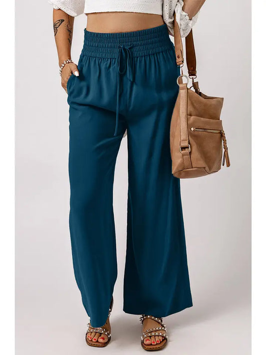 Pants - Smocked elastic waist with a drawstring tie, makes it easy to pull on.  Side pockets and wide legs - Viscose and Polyester 