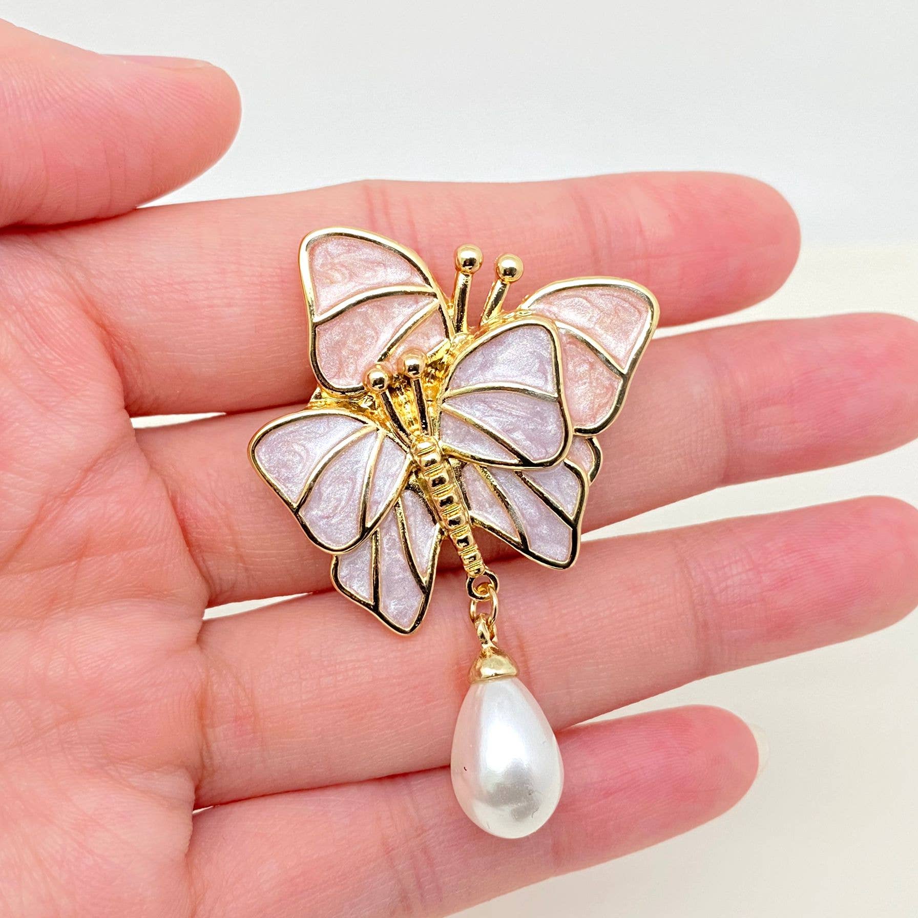 Feminine Butterfly Brooch with a pearl dangle...designed with two pearlized butterflies in light purple and light pink